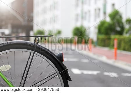 Background Blurred. Bicycles Parked In Front Of Apartments In Japan.