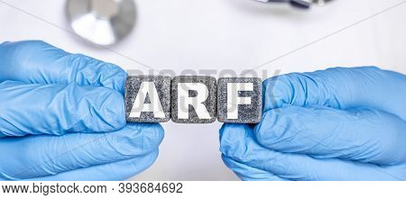 Arf Acute Renal Kidney Failure - Word From Stone Blocks With Letters Holding By A Doctors Hands In M