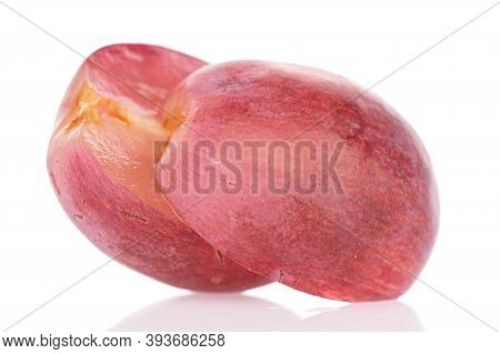 Group Of Two Halves Of Fresh Red Globe Grape One Sliced Berry Isolated On White