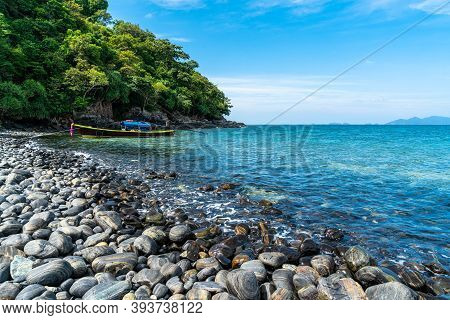 Beautiful Rock Beach With Tourist Long Tail Boat In Koh Hin Ngam, Tarutao National Park, Thailand.