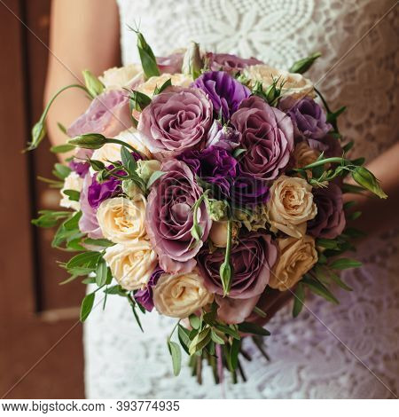 Young Beautiful Bride In White Dress Holding Wedding Bouquet, Bouquet Of Bride From Rose Cream Spray