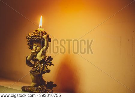 The Glowing Candle On A Cute Candle Stand