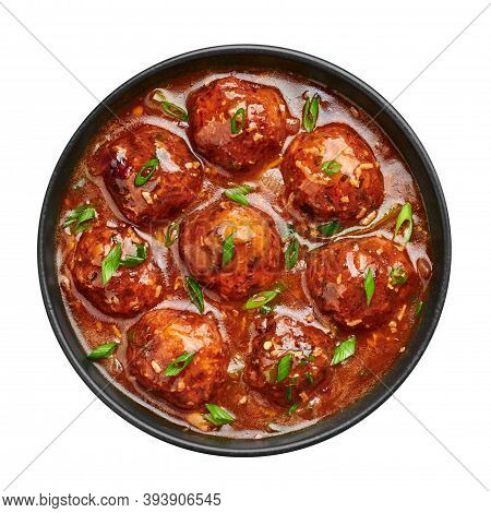 Veg Manchurian Gravy Balls In Black Bowl Isolated On White. Vegetarian Manchurian Is Indian Chinese 