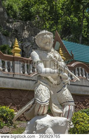 Thailand, Phetchaburi 19.07.2019 View Of Wat Tham Khao Yoi Cave, Buddhist Temple With Green Tree And
