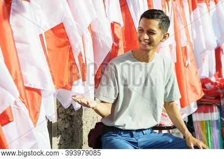 Portrait Of A Young Man Selling Flags