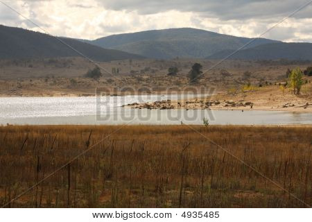 Sun Shines Onto The Lake On An Overcast Day