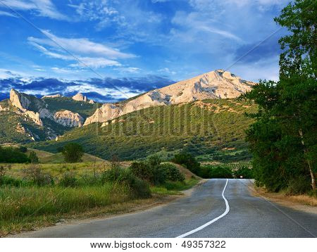 Road, Mountains And Blue Sky