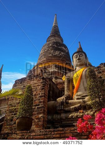 Ancient structure with old pagodas against blue sky