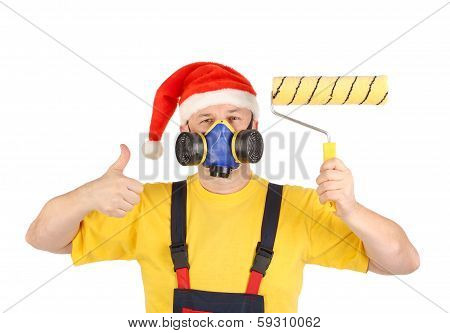Worker in gas mask and santa hat with roller