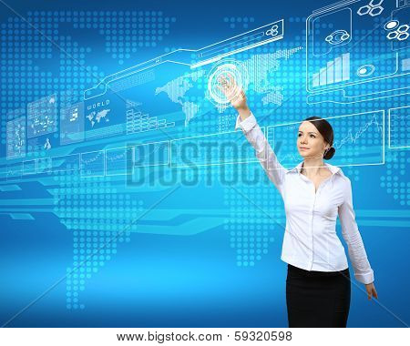 BusinesswomBusinesswoman standing and working wth touch screen technologyan and touch screen technology