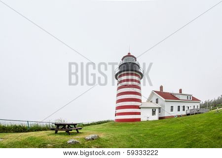 LUBEC-JULY 10: West Quody lighthouse in fogy day in Maine, USA on July 10, 2013.