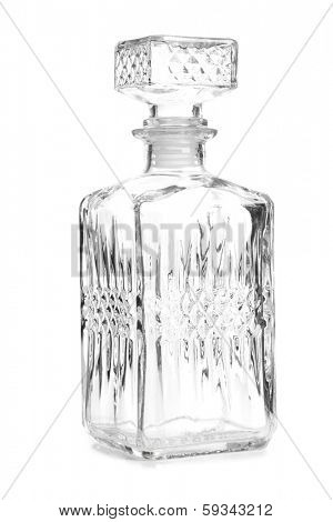 Glass decanter of whiskey on white background