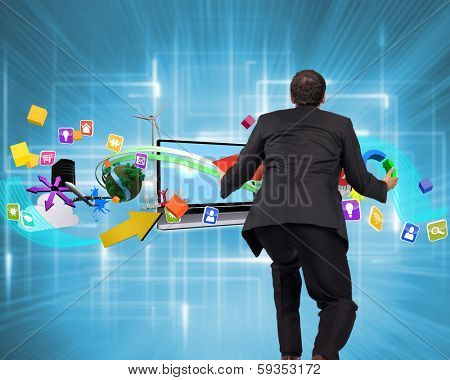 Businessman posing with arms outstretched against multiple geometric lights