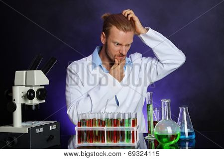 Crazy scientist working in laboratory
