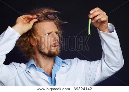 Crazy scientist working in laboratory