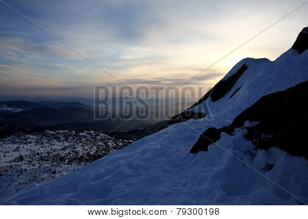Sunset is in mountains.