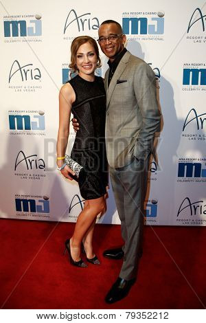 LAS VEGAS-APR 4: ESPN sportscaster Stuart Scott (R) and Kristin Spodobalski attend the 13th annual Michael Jordan Celebrity Invitational gala at the ARIA Resort & Casino on April 4, 2014 in Las Vegas.