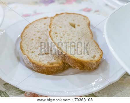 Two Breads On White Plate Ready To Eat
