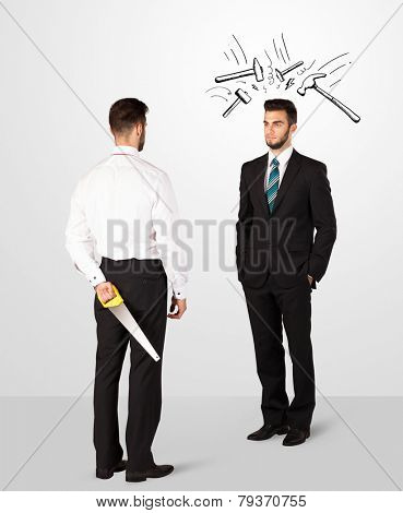Ruthless businessman hiding a weapon white drawn beating hammer marks 