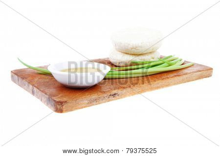 dairy products : feta white cheese on cut board isolated over white background