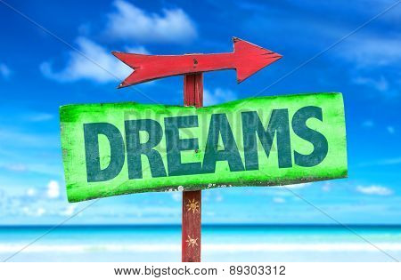 Dreams sign with beach background