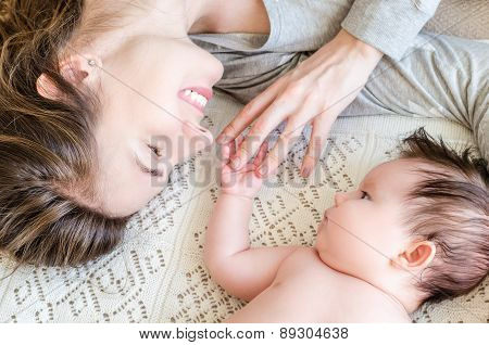 Portrait Of Happy Beautiful Mother And Cute Newborn Baby Girl
