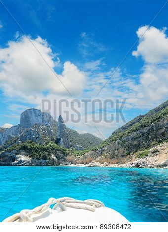Reaching Cala Goloritze On A White Boat Under Clouds