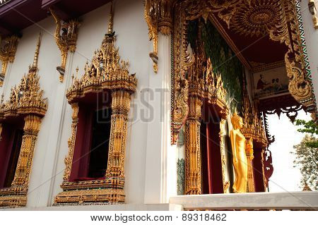 Standing Buddha Front Of Church On Thai Temple In Thailand.
