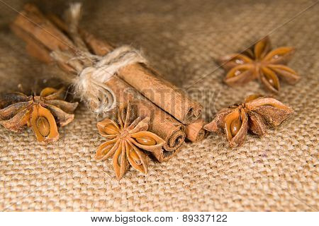 Star Anise And Cinnamon Sticks On Old Cloth