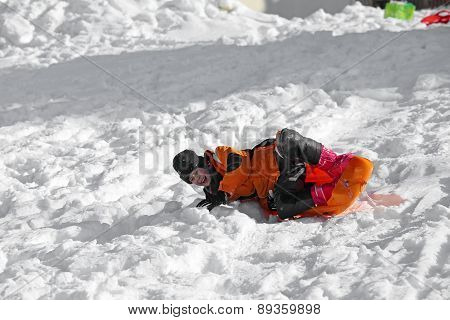 Young Boy With Wool Cap In The Winter Plays With Bob
