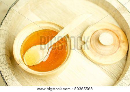 Honey In A Wooden Bowl