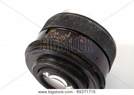 An Old Manual Control Camera Lens Isolated On White