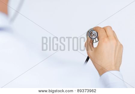 picture of doctor hand with stethoscope listening somebody