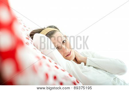 Young Woman Lying Resting On A Bed