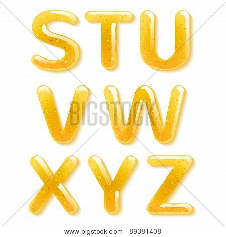 Yellow honey jelly alphabet. Glossy letters.