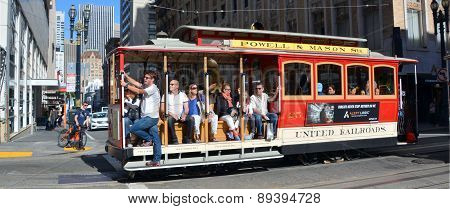 Passengers enjoy a ride in a cable car