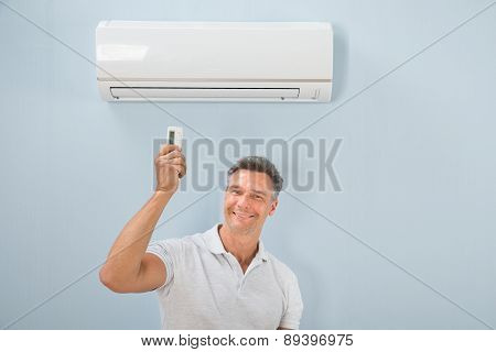Man Operating Air Conditioner