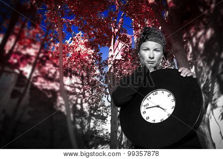 Girl On The Ruins Of The House With A Huge Clock In His Hands.