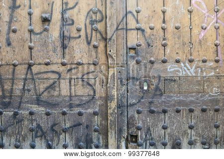 Grunge, old wooden door Castilian style in Toledo Spain