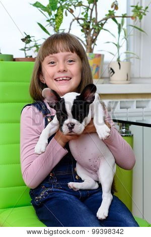 Girl With Bulldog Puppy