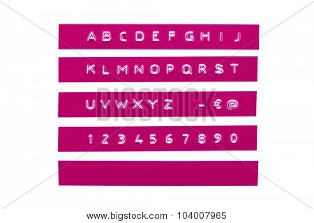 Embossed alphabet on purple plastic tape