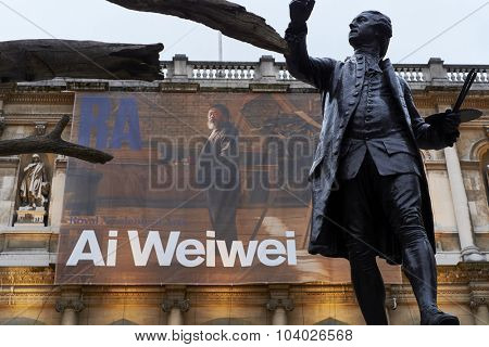 LONDON, UK - SEPTEMBER 23: Statue of Sir Joshua Reynolds with Ai Wei Wei's banner in the background, at the forecourt of the Royal Academy of Arts. September 23, 2015 in London.