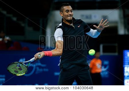 KUALA LUMPUR, MALAYSIA - SEPTEMBER 30, 2015: Nick Kyrgios of Australia attempts a forehand return in his match at the Malaysian Open 2015 Tennis tournament held at the Putra Stadium, Malaysia.