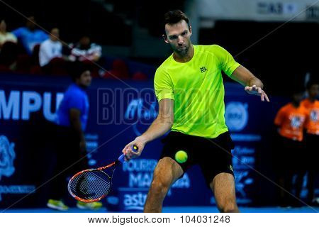 KUALA LUMPUR, MALAYSIA - SEPTEMBER 30, 2015: Ivo Karlovic of Croatia hits a forehand return in his match at the Malaysian Open 2015 Tennis tournament held at the Putra Stadium, Malaysia.