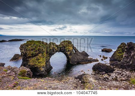 July day in Iceland. Magical coastal cliffs fishing village Arnastapi