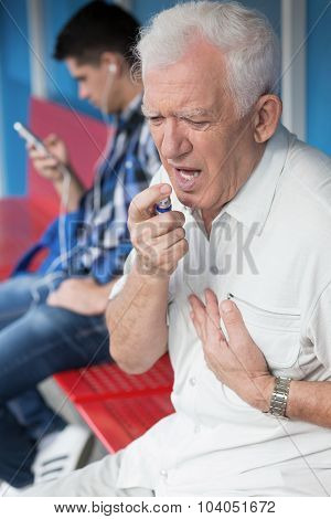Senior Man Taking Nitroglycerin