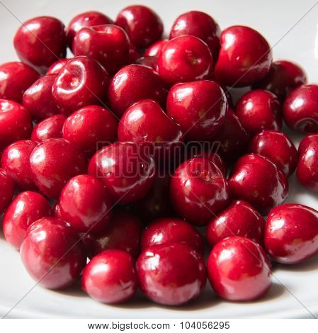 Bowl Of Red Fresh Cerries On A White Background