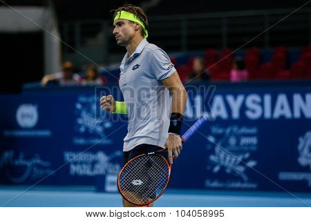 KUALA LUMPUR, MALAYSIA - OCTOBER 01, 2015: David Ferrer of Spain reacts after scoring a point in his match at the Malaysian Open 2015 Tennis tournament held at the Putra Stadium, Malaysia.