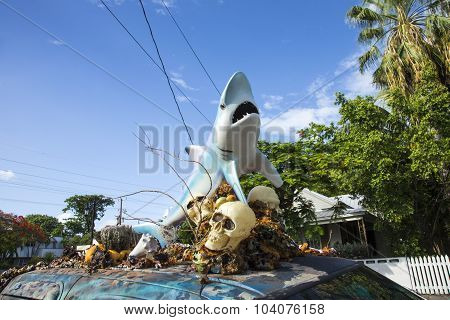 Car With A Sculpture Of A Shark And Skull And Plastic Shells On The Roof