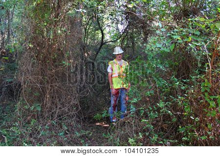 MUSKOGEE, OK - Sept. 12: A man dressed as a zombie waits for runners during the Castle Zombie Run at the Castle of Muskogee in Muskogee, OK on September 12, 2015.
